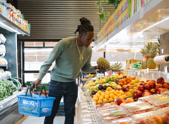 Photo by Greta Hoffman  from Pexels: https://www.pexels.com/photo/man-in-grocery-store-picking-pineapple-9705816/